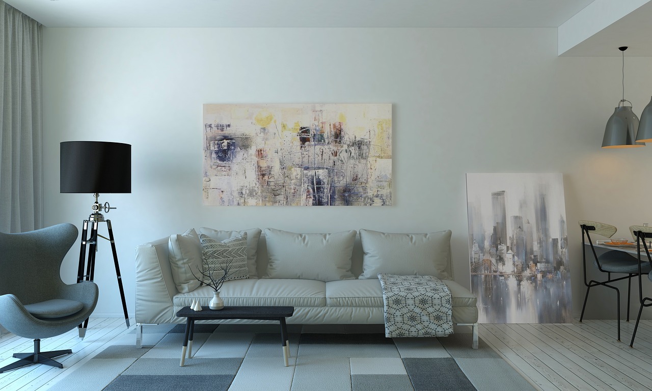 movers wrapping furniture inside home
